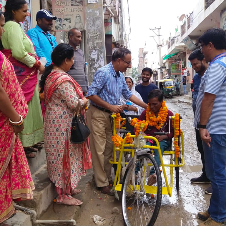 A beneficiary of Project Aarambh being provided with necessary support to successfully run his enterprise and become self-reliant by ETASHA Society.