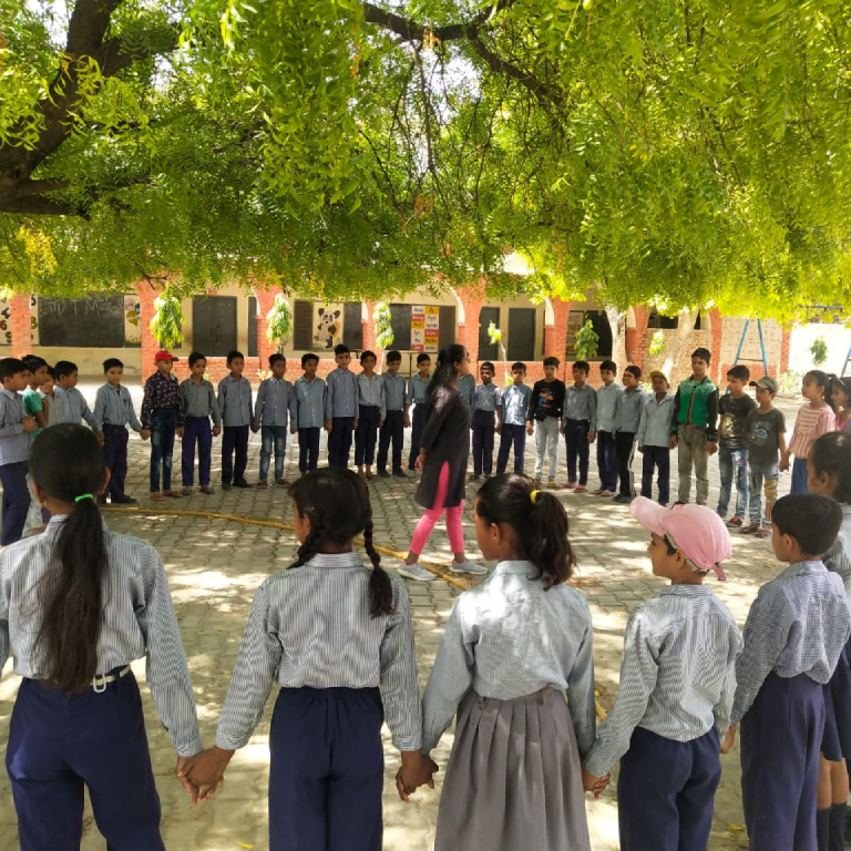 Adolescents attending a confidence building workshop organized by ETASHA Society to help students develop confidence and a positive outlook toward life through active participation.