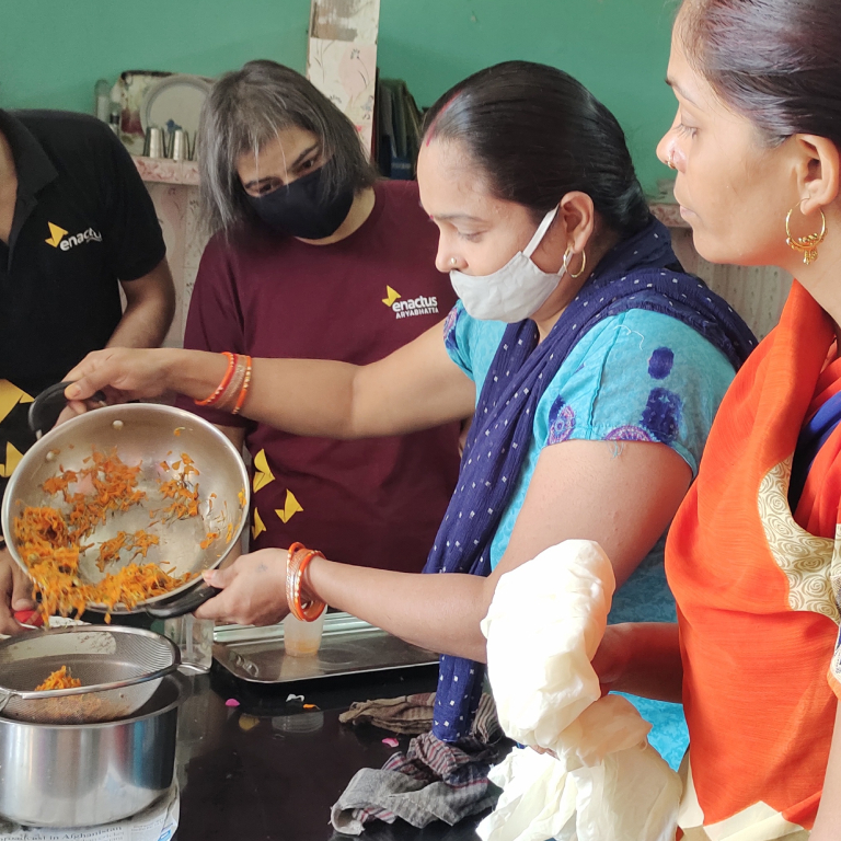 Participants of Women Entrepreneurship Program learning details of how to make a soap. The program aims to empower stay-at-home women who may be illiterate or semi-literate to generate income through self-owned and managed enterprises.