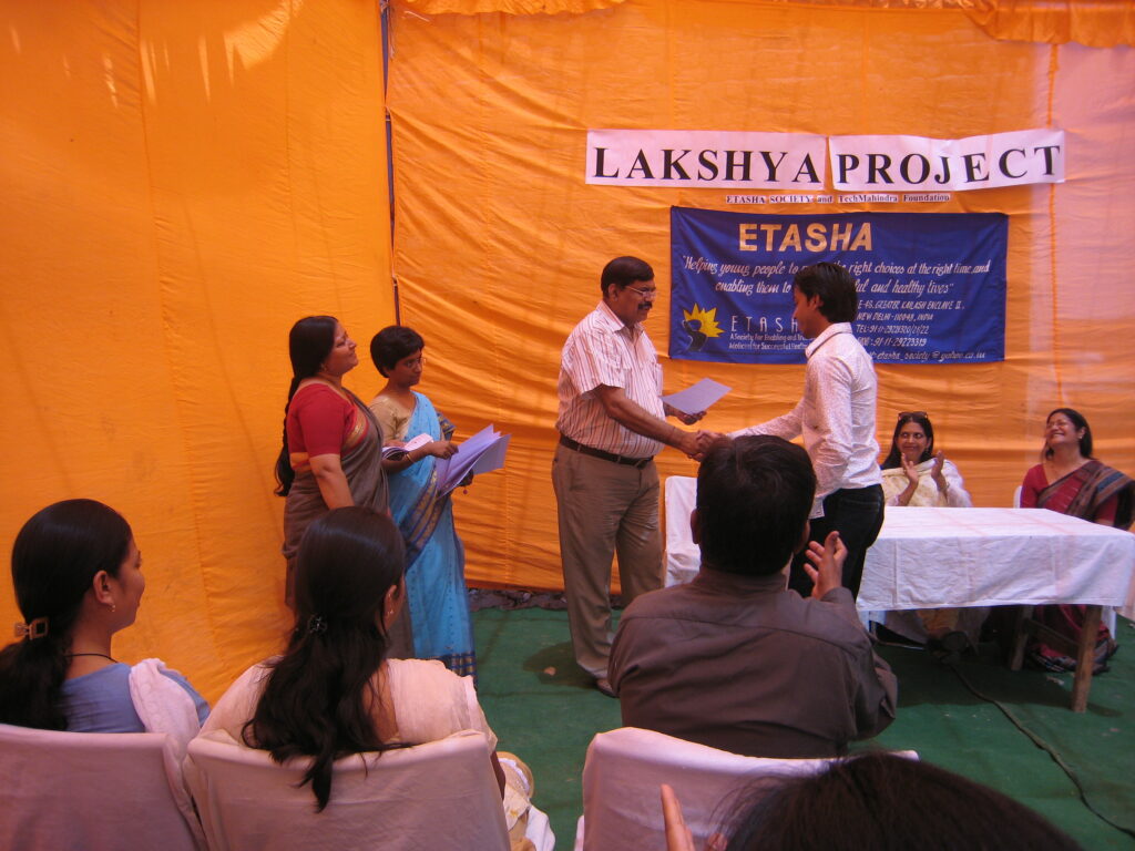 Beneficiary of Project Lakshya receiving his certificate of completion. The 2-year project was implemented by ETASHA Society in 2008 with support from Tech Mahindra Foundation. The program was implemented in Madanpur Khadar and NOIDA.